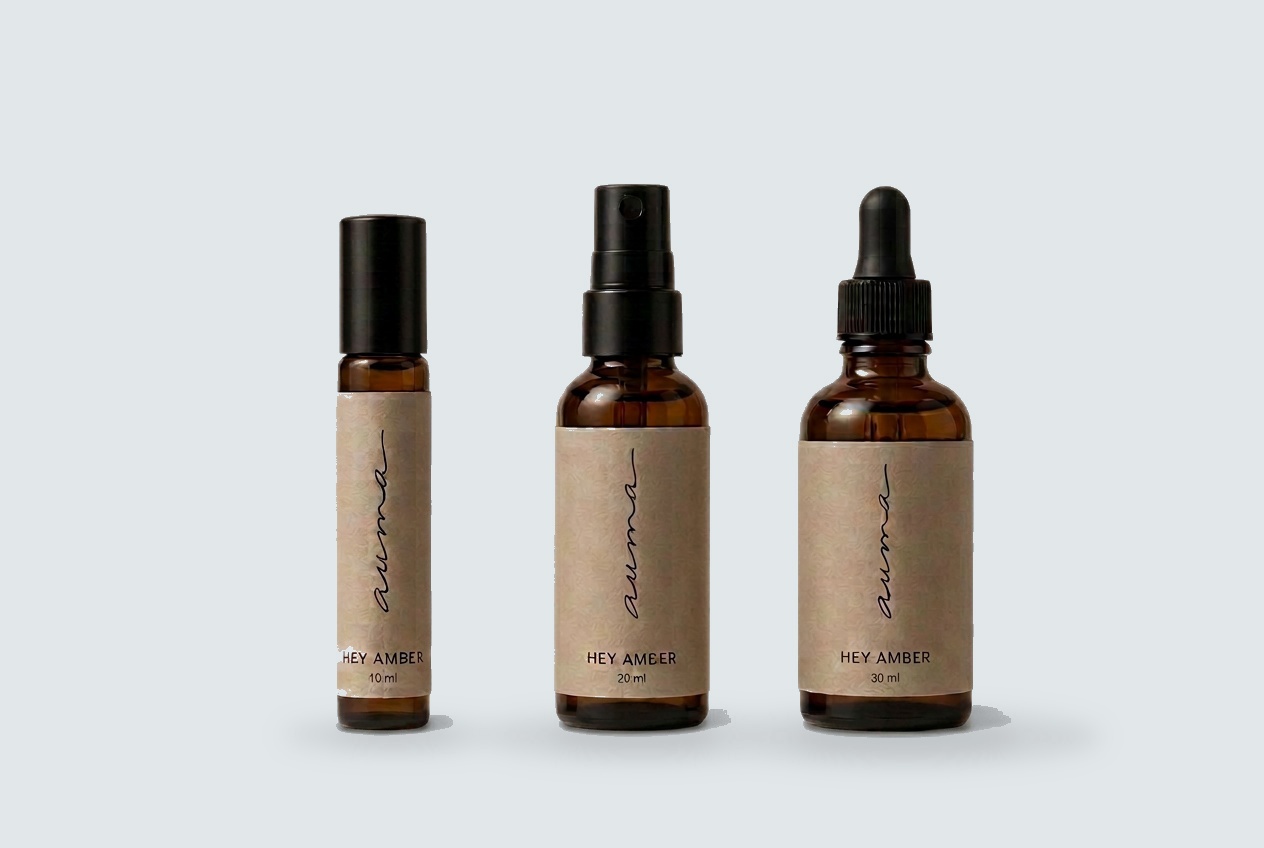 Hey Amber perfume oil in roller, dropper and elixir bottles
