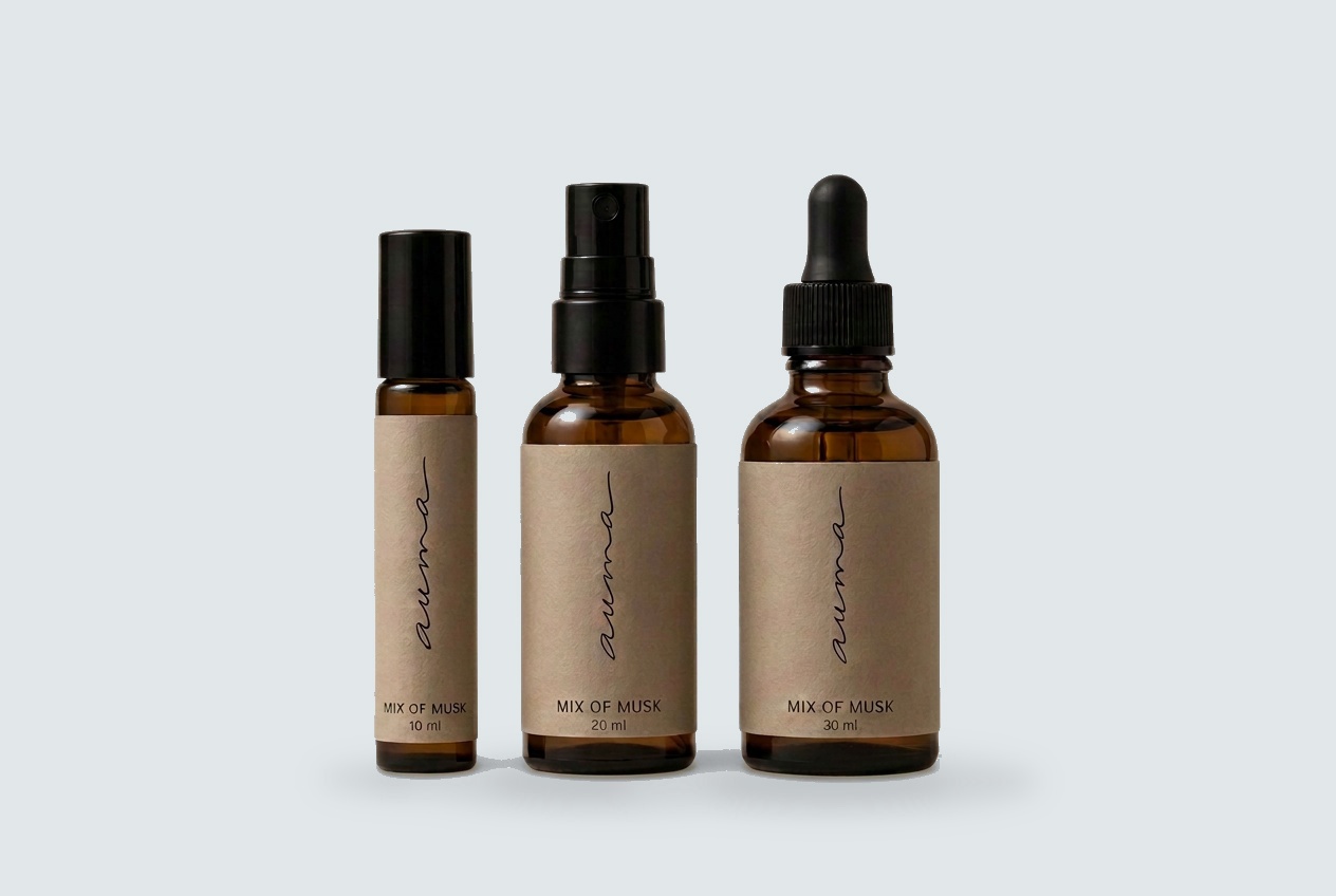Mix of Musk perfume oil in roller, dropper and elixir bottles